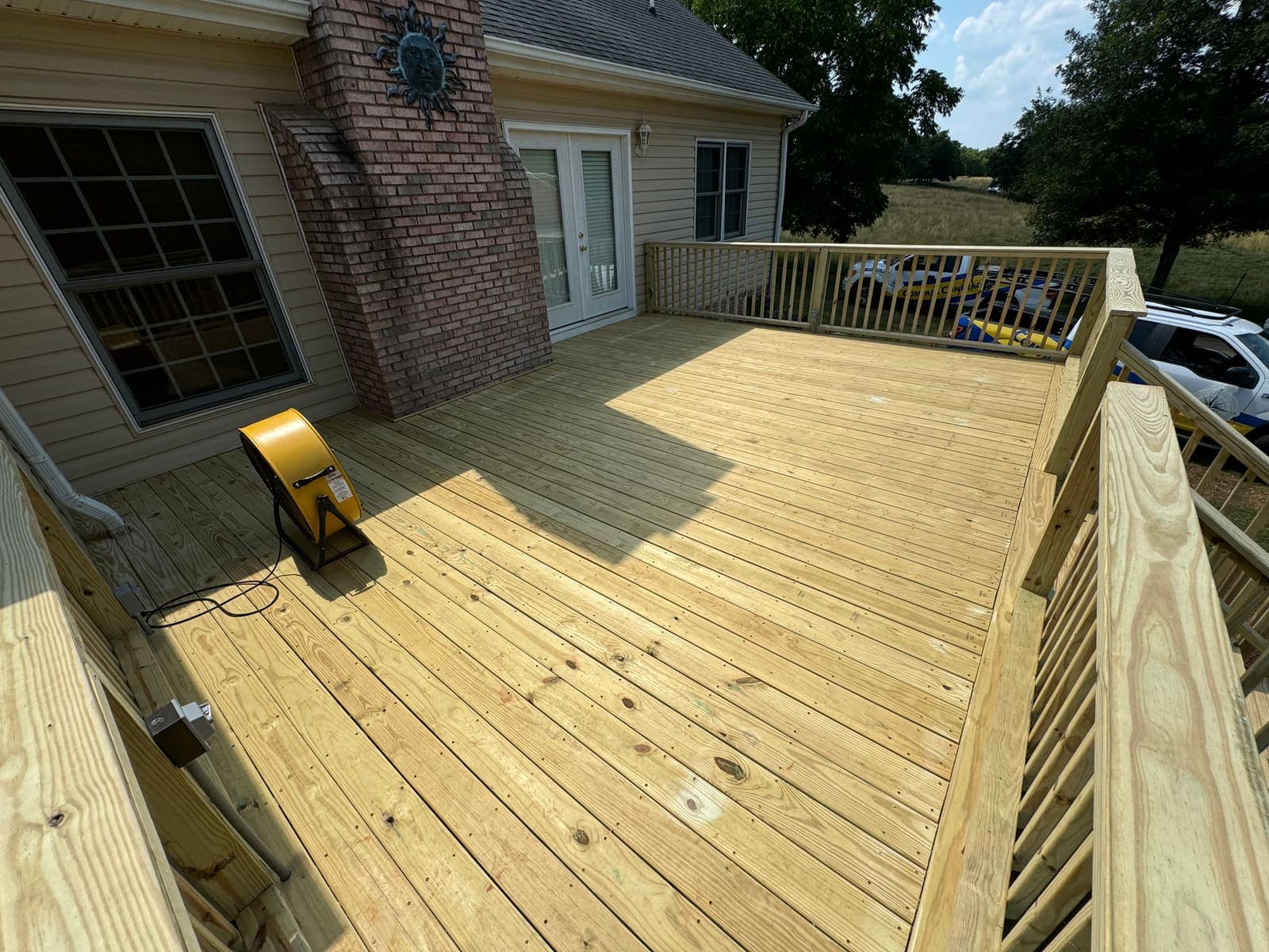 A beautiful wooden deck built in a backyard in York County, South Carolina.