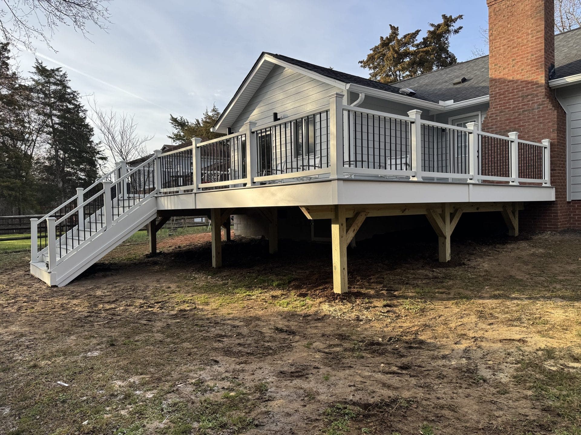 Beautiful composite deck built in Tega Cay with built-in seating and lake view