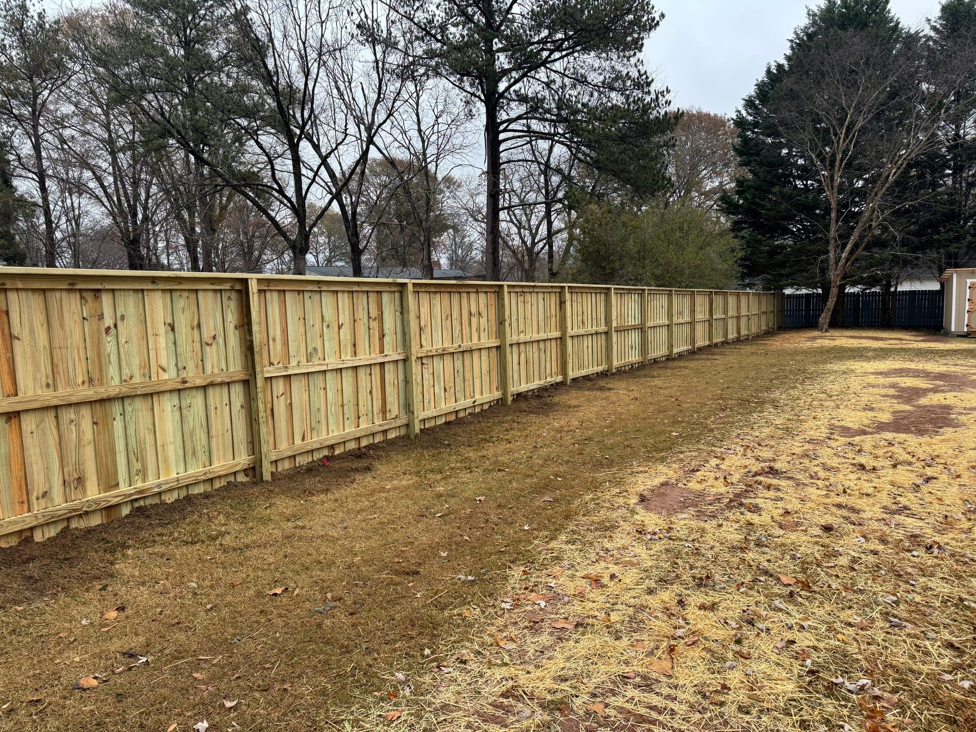 Privacy fence installation in a residential backyard in Rock Hill, SC