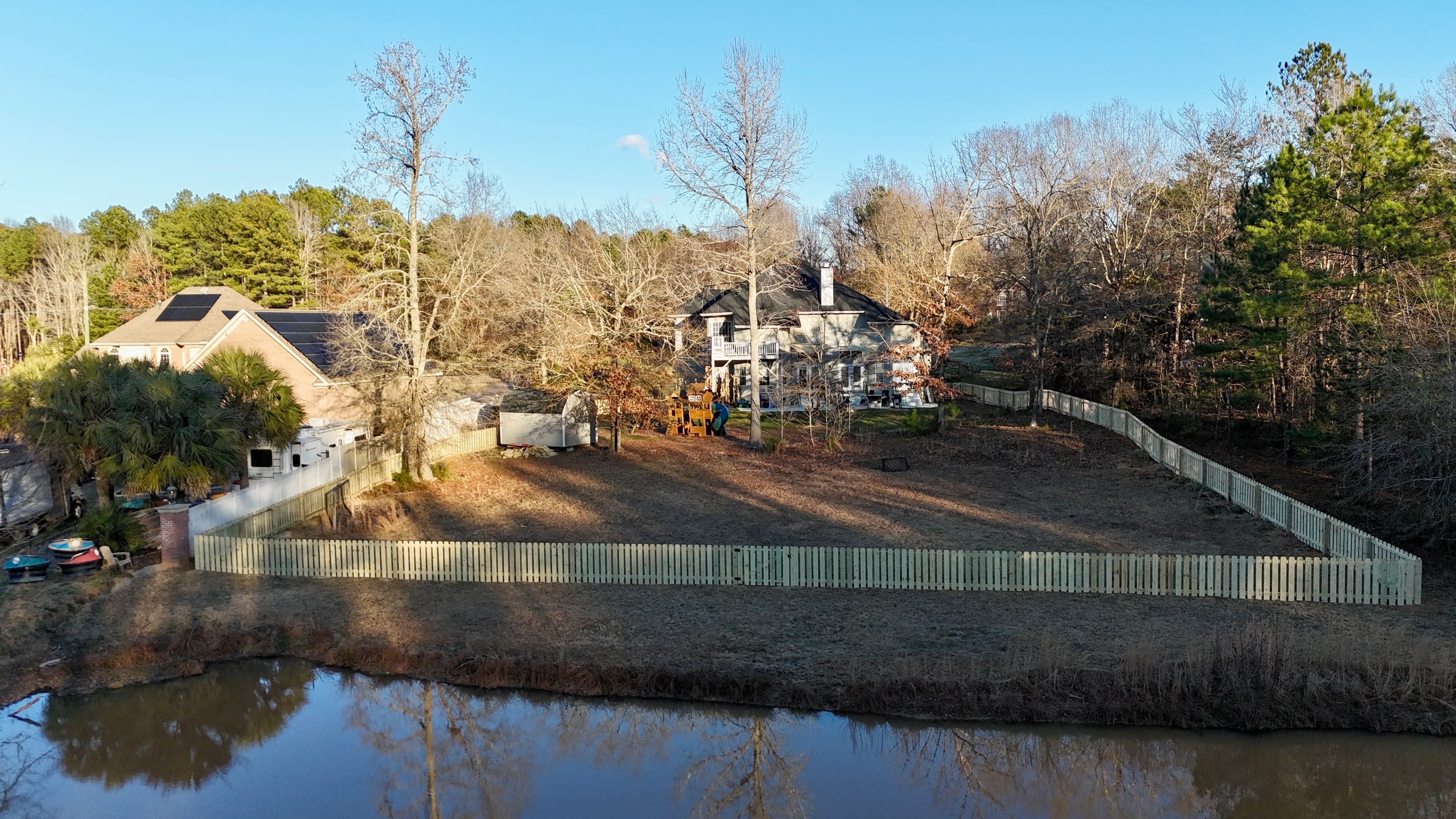A well-built wooden fence in a residential yard in Rock Hill, SC.
